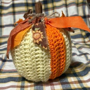 Hand made crochet pumpkin with fall ribbons and cinnamon stick stem.